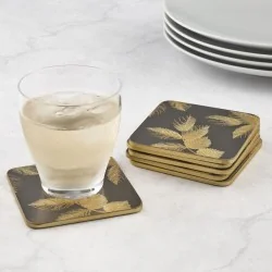 Glass and plates on table with Etched Leaves Dark Grey coasters by Sara Miller